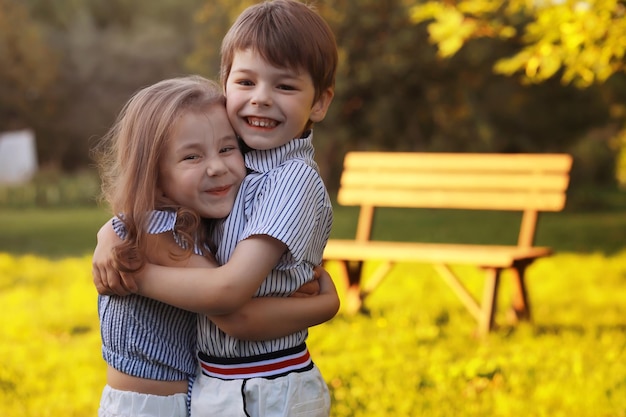 Children on a walk in the summer. Children indulge in the country. Laughter and splashing water.