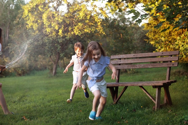 Children on a walk in the summer Children indulge in the country Laughter and splashing water