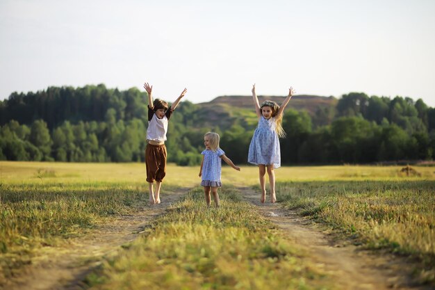 Children walk in the summer in nature Child on a sunny spring morning in the park Traveling with children