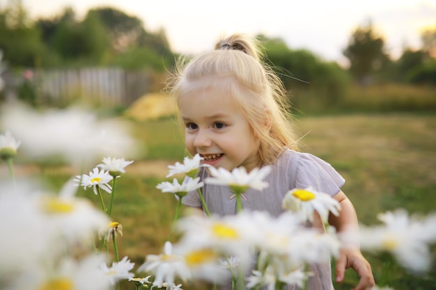 Children walk in the summer in nature Child on a sunny spring morning in the park Traveling with children