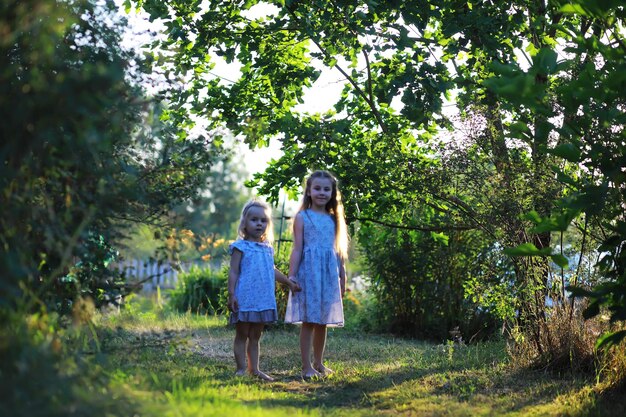children walk in the summer in nature child on a sunny spring morning in the park traveling with children