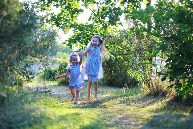 children walk in the summer in nature child on a sunny spring morning in the park traveling with children