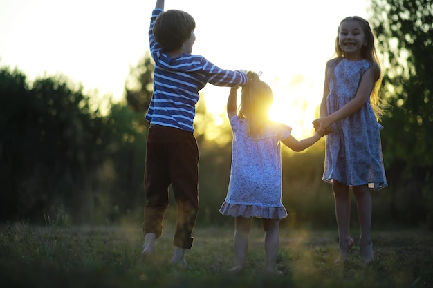 Children walk in the summer in nature Child on a sunny spring morning in the park Traveling with children