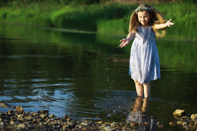 Children walk in the summer in nature Child on a sunny spring morning in the park Traveling with children