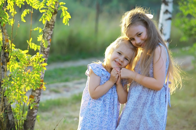 Children walk in the summer in nature Child on a sunny spring morning in the park Traveling with children