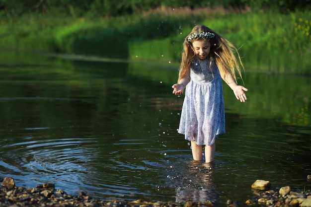 Children walk in the summer in nature Child on a sunny spring morning in the park Traveling with children