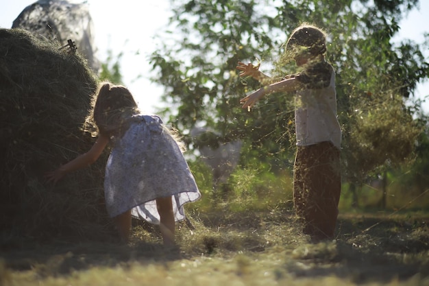 Children walk in the summer in nature Child on a sunny spring morning in the park Traveling with children