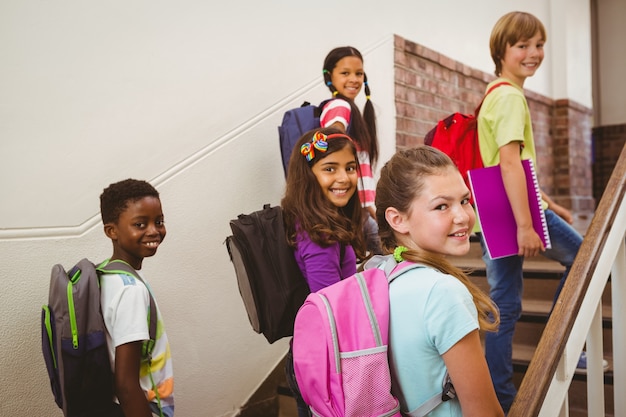 Photo children walking up stairs in school