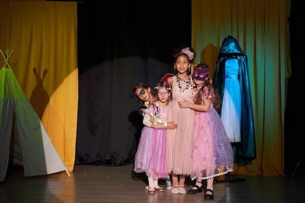 children wearing costumes performing in school play