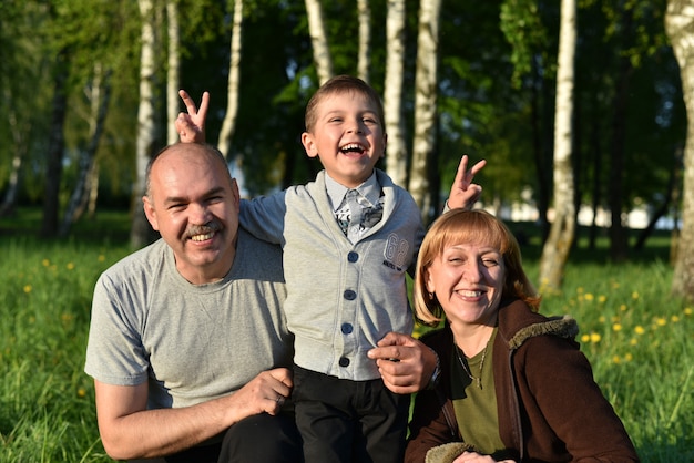 Children with parents play in the park