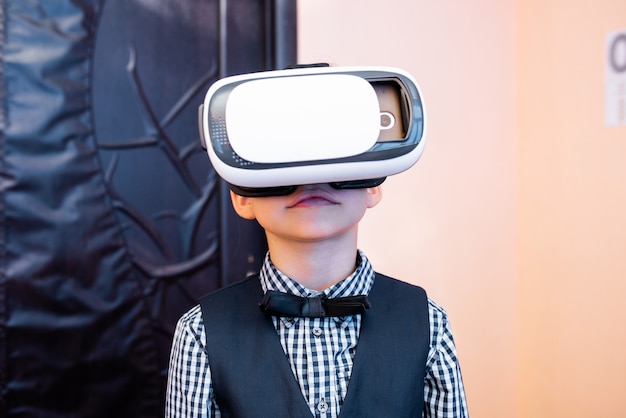 Children with virtual reality glasses are in the school office