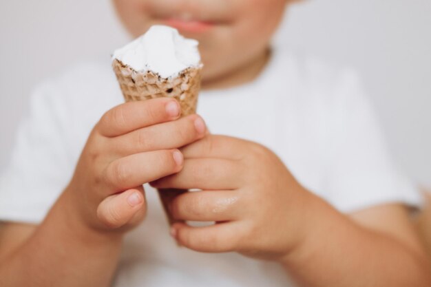children039s hands with a waffle cup of ice cream