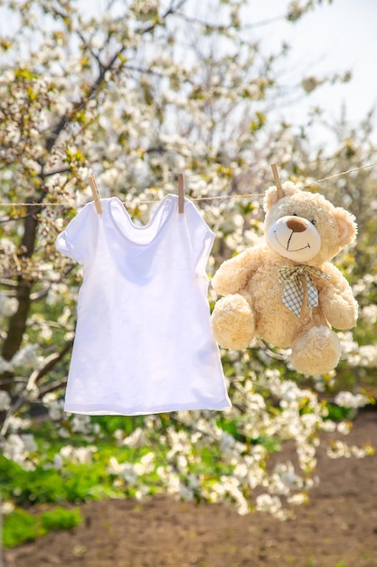 Childrens clothes are dried outside Selective focus