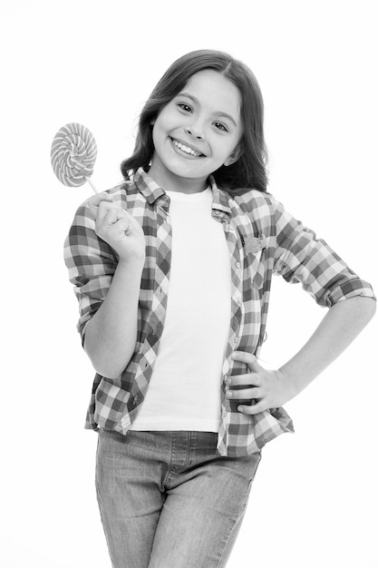 Photo childrens menu girl cute smiling face holds sweet lollipop sweets in appropriate portions ok girl likes sweets as lollipop candy isolated white background celebrate holidays birthday with sweets