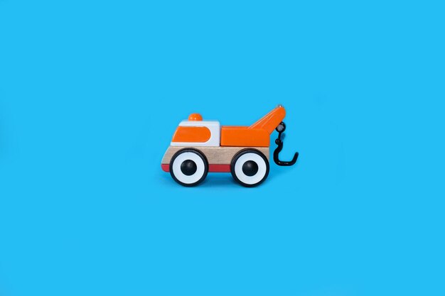 Childrens toy car on a bright blue background