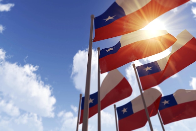 Chile flags waving in the wind against a blue sky d rendering