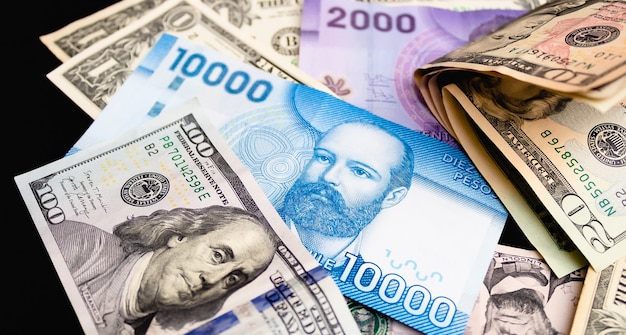 Chile money and united states dollar in photography for foreign exchange market concept