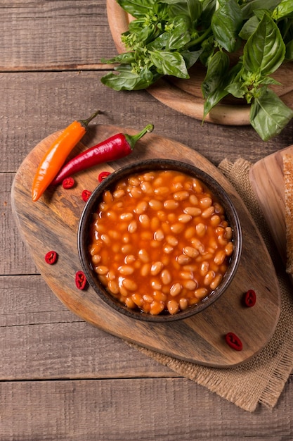 Chili beans on wooden table background. Kidney beans and vegetable Mexican food.