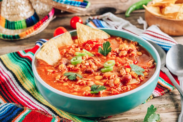 Chili Con Carne in bowl with tortilla chips