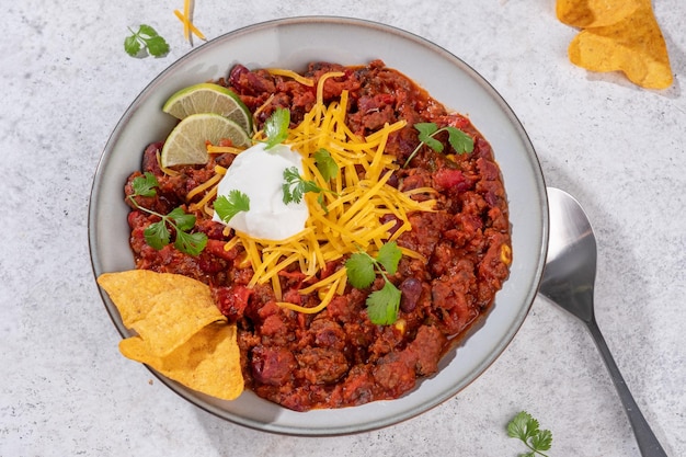 Chili con carne  traditional mexican minced meat and vegetables stew in tomato sauce