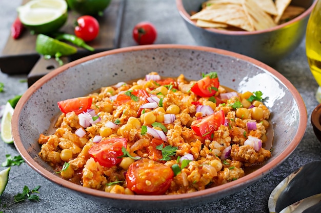 Chili con carne of turkey  with chickpeas served with nachos.  