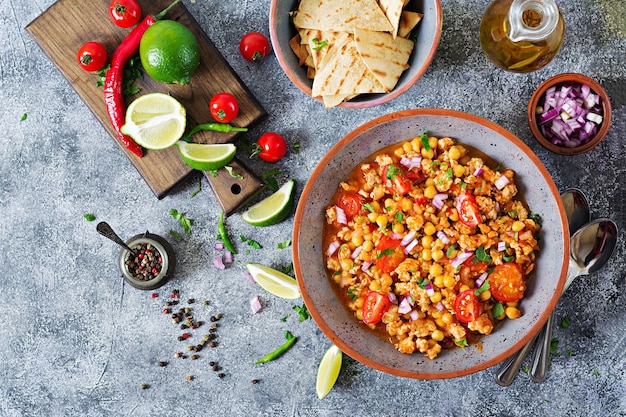 Chili con carne of turkey  with chickpeas served with nachos.  