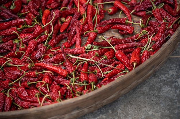 Chili drying in a wicker bowl