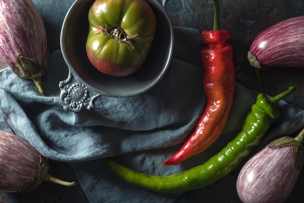 Chili eggplant and tomato on the table