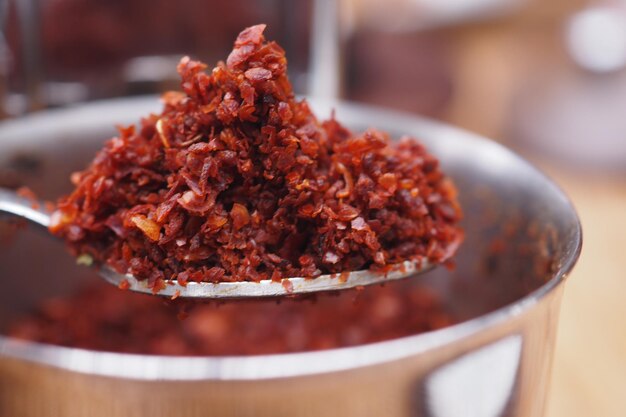 Chili flakes on a spoon closeup