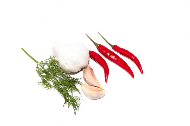 Chili pepper, garlic, black pepper on a white background, a set of sharp ingredients