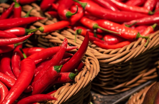 Chili peppers in a basket in a supermarket closeup