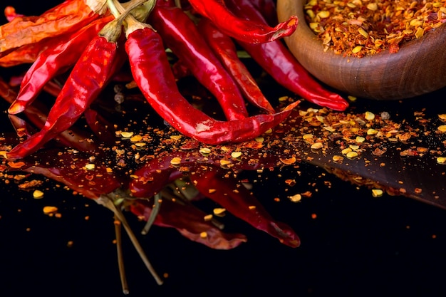 chili peppers on a black background