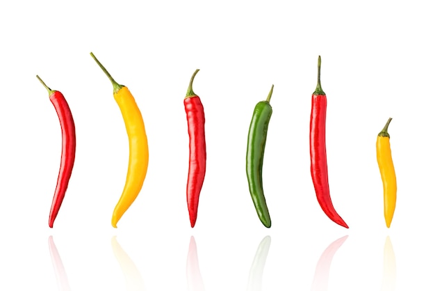 Chili peppers, chillies, red, green, and yellow, isolated on white background with drop shadow.