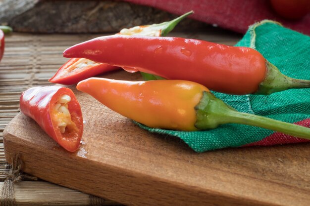 Chili peppers on a wooden table top view