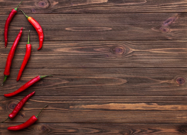 Chili peppers on wooden table