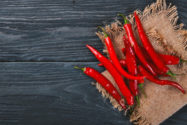 Chili red pepper On a wooden background Top view Free space for your text