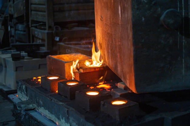 The chill mold cools down after pouring liquid steel closeup with selective focus and background blur