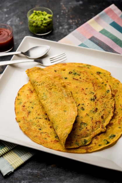 Chilla or Besan cheela is a simple pancake made with chickpea flour and some basic ingredients served with green chutney and tomato sauce, also known as veg-omelette