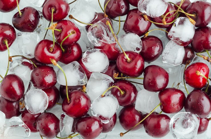 Chilled berry. sweet, juicy, ripe cherries on ice cubes. background