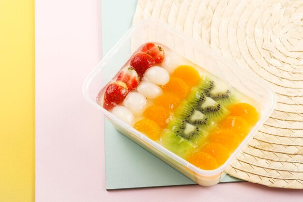 Chilled Cold Jelly Pudding with Fresh Fruit Lychee Strawberry Orange  and Mixed Cocktail Fruit on Top in Plastic Transparent Bento Box Dessert Menu