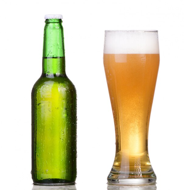 Chilled green bottle with condensate and a glass of beer lager on Isolated white background