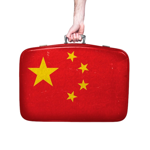 China flag on a vintage leather suitcase