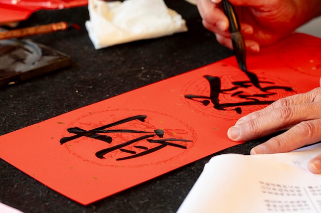 Photo china spring festival calligrapher brush characters chinese spring festival