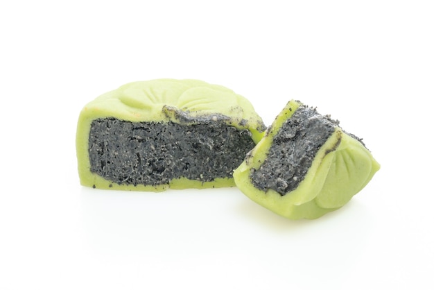 Chinees groene de theesmaak van de maancake met zwarte geïsoleerde sesam