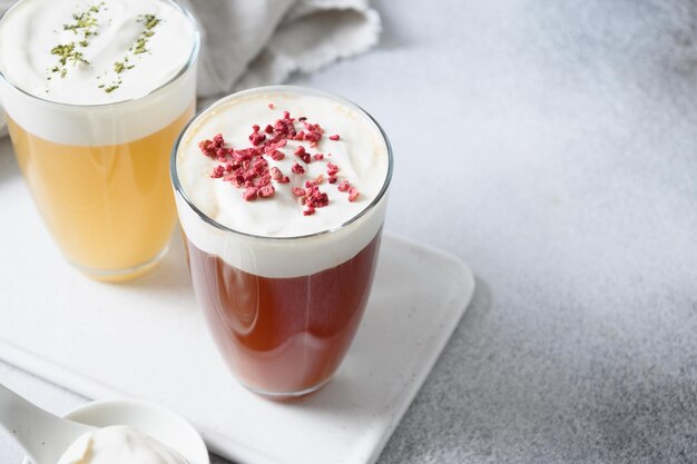 Chinese asian beverage cheese oolong and black tea with layer of cream cheese foam topped Close up Copy space