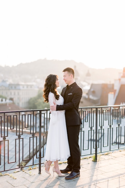 Chinese bride with groom on roof of the building