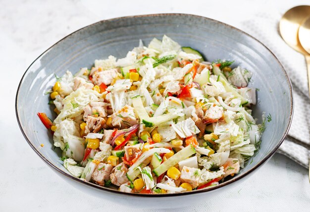 Photo chinese cabbage salad with chicken meat corn cucumber and dressing mustard asian food