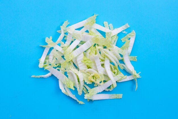 Chinese cabbage sliced on blue