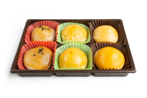 Chinese Cake, sweet dessert, stuffed with beans and egg yolks in a plastic box container.