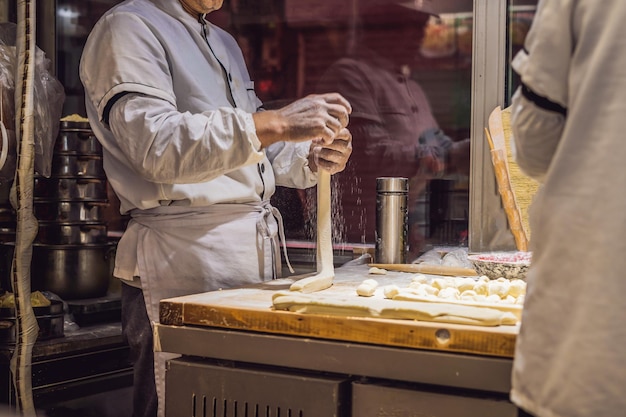 Chinese chef making dumplings in the kitchen